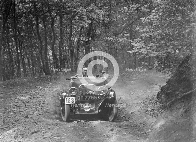 1496 cc Singer competing in the B&HMC Brighton-Beer Trial, Fingle Bridge Hill, Devon, 1934. Artist: Bill Brunell.