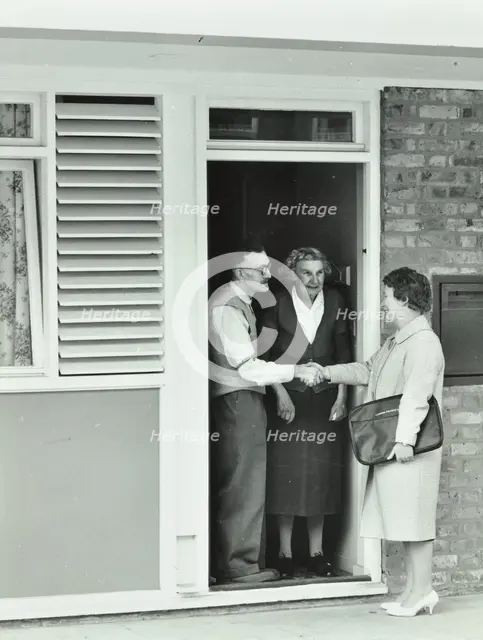 16 Candy Street, Poplar, London: elderly couple greet Welfare Officer, 1962. Creator: Unknown.