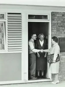 16 Candy Street, Poplar, London: elderly couple greet Welfare Officer, 1962. Creator: Unknown