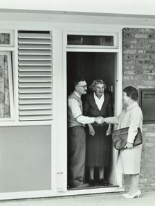 16 Candy Street, Poplar, London: elderly couple greet Welfare Officer, 1962. Creator: Unknown