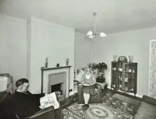 16 Candy Street, Poplar, London: elderly couple in a new flat, 1962. Creator: Unknown