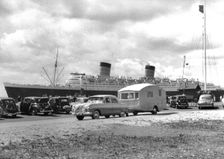 1952 Ford Zephyr towing Winchester Pipit caravan Queen Elizabeth in B/g.. Creator: Unknown