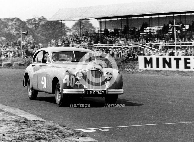 1953 Jaguar MkVII, Stirling Moss at Silverstone. Creator: Unknown.