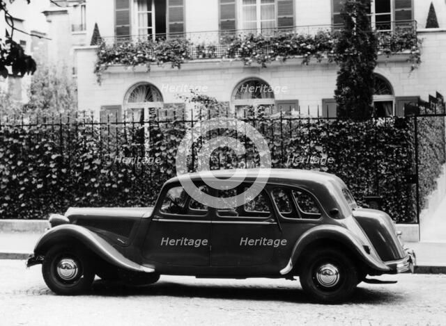 1954 Citroën 15CV Familiale parked outside a house. Artist: Unknown