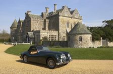 1954 Jaguar XK140 outside Palace House, Beaulieu