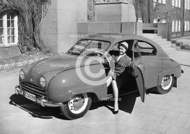 1954 Saab 92b with female model. Creator: Unknown.