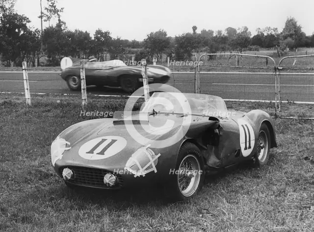 1955 Le Mans, Hawthorn's Jaguar D type passes de Portago's stricken Ferrari. Creator: Unknown.