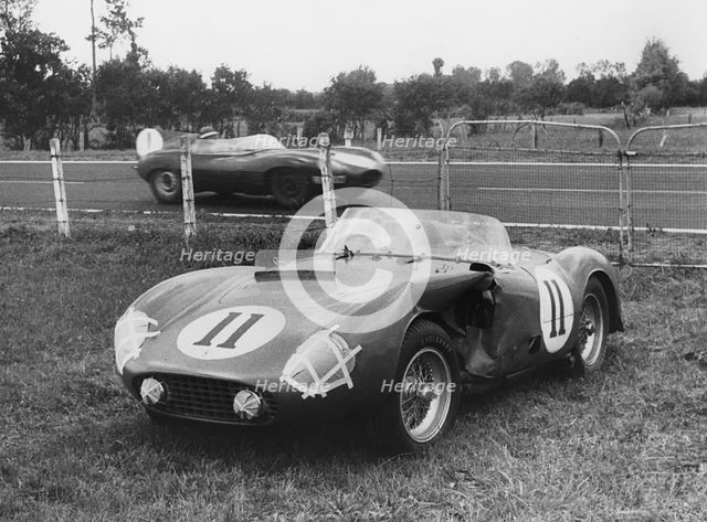 1955 Le Mans, Hawthorn's Jaguar D type passes de Portago's stricken Ferrari. Creator: Unknown.