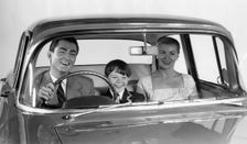 1957 Vauxhall Victor with family together in front seat. Creator: Unknown