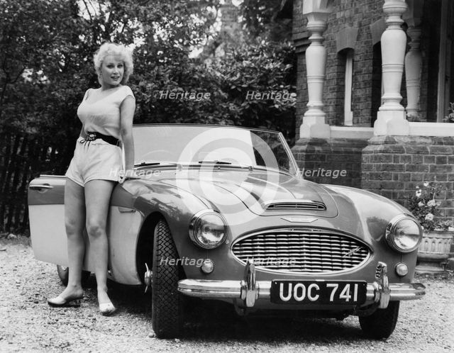 1957 Austin - Healey 100-6 with model. Creator: Unknown.