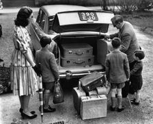 1959 Morris Oxford Series V with family and luggage (courtesy B.M.I.H.T). Creator: Unknown
