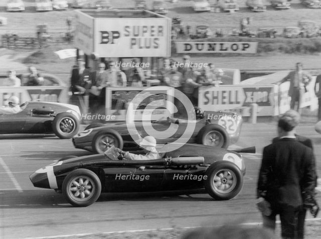 1959 Stirling Moss  in Cooper Borgward, next to Graham Hill in Lotus Climax. Creator: Unknown.