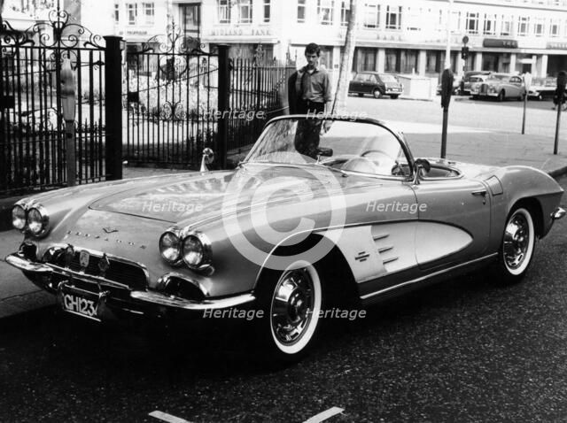 1961 Chevrolet Corvette on a parking meter, (c1961?). Artist: Unknown