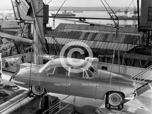 1962 Jaguar MkX being loaded on to Saxonia ship at Southampton docks for export. Creator: Unknown.