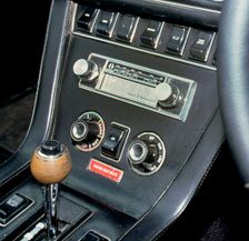 1974 Jensen Interceptor dashboard showing 8 track cartridge sound system. Creator: Unknown