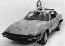 1976 Triumph TR7 with female model. Creator: Unknown