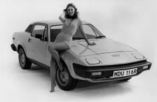 1976 Triumph TR7 with female model. Creator: Unknown