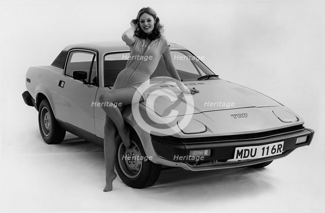 1976 Triumph TR7 with female model. Creator: Unknown.