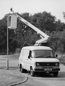 1981 Ford Transit 190 van with extending boom. Creator: Unknown