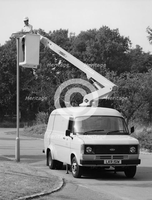 1981 Ford Transit 190 van with extending boom. Creator: Unknown.