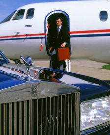 1987 Rolls Royce Silver Spirit with executive disembarking jet