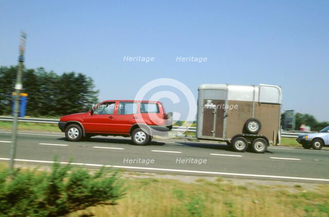 1997Ford Maverick towing horse box. Artist: Unknown.