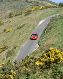 1996 Suzuki Baleno GS Sport on winding country lane,Dorset