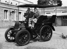 1900 Royal Daimler, with H.R.H. Queen Elizabeth with Lord Montagu in 1977. Creator: Unknown