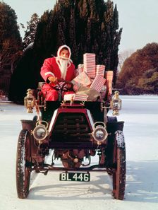 1901 Durkopp with Santa Claus delivering Christmas gifts. Creator: Unknown
