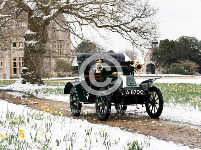 1904 De Dion Bouton model Q in snow with daffodils at Beaulieu. Creator: Unknown.