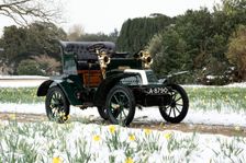 1904 De Dion Bouton model Q in snow with daffodils at Beaulieu. Creator: Unknown