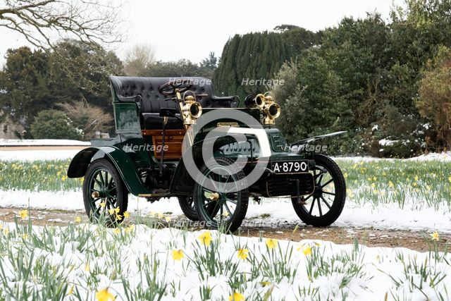 1904 De Dion Bouton model Q in snow with daffodils at Beaulieu. Creator: Unknown.