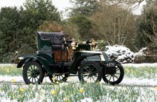 1904 De Dion Bouton model Q in snow with daffodils at Beaulieu. Creator: Unknown