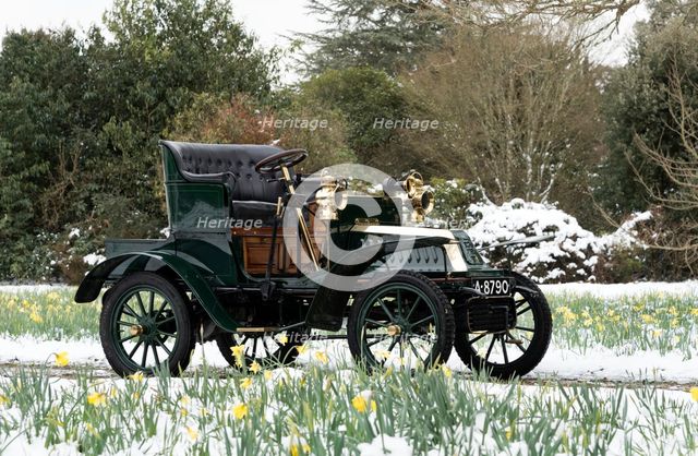 1904 De Dion Bouton model Q in snow with daffodils at Beaulieu. Creator: Unknown.