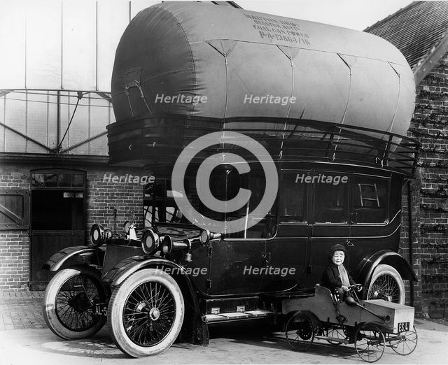 1913 Lanchester with gas bag conversion and boy in pedal car. Creator: Unknown.