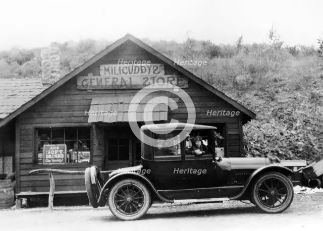 1916 Cadillac V8 car, parked outside a general store, USA, (c1916?). Artist: Unknown