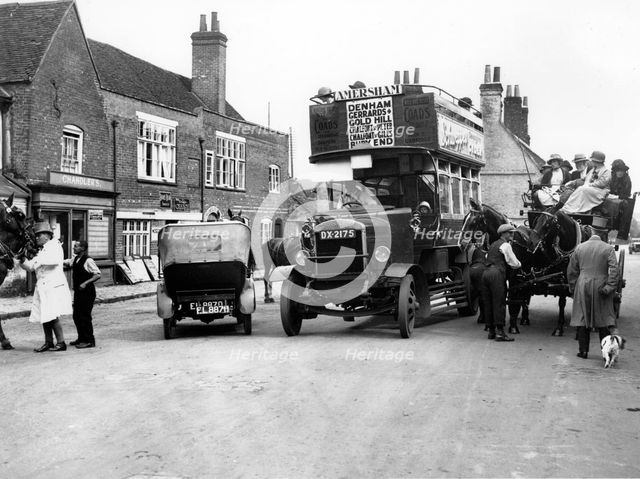 1920's Thornycroft J bus in busy street scene. Creator: Unknown.