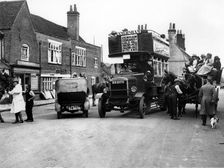 1920's Thornycroft J bus in busy street scene. Creator: Unknown
