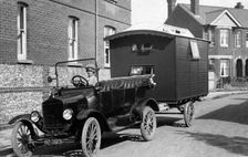 1921 Ford Model T with caravan. Creator: Unknown