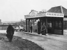 1923 Calcott 10hp at petrol station. Creator: Unknown