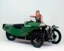 1927 Morgan Aero 3 wheeler with female "flapper" model. Creator: Unknown