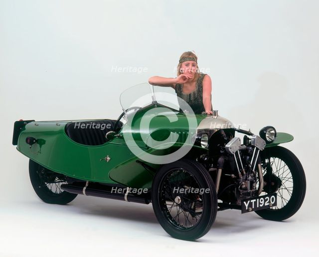 1927 Morgan Aero 3 wheeler with female "flapper" model. Creator: Unknown.