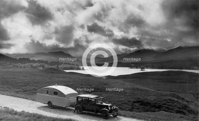 1930 Morris Oxford Six with Winchester Streamline caravan. Creator: Unknown.