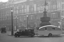 1930 Morris Oxford Six with Winchester Streamline caravan, Picadilly. Creator: Unknown