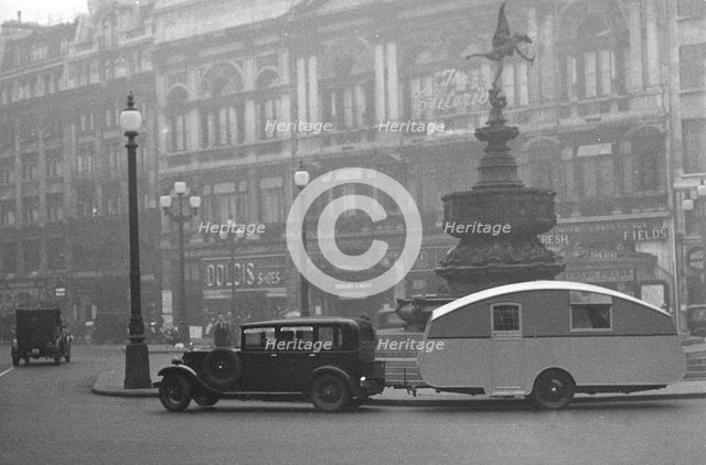 1930 Morris Oxford Six with Winchester Streamline caravan, Picadilly. Creator: Unknown.