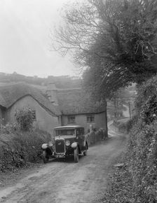 1931 Austin 16/6 on a road test, parked outside Parliament Cottage, Stoke Gabriel, Devon. Artist: Bill Brunell
