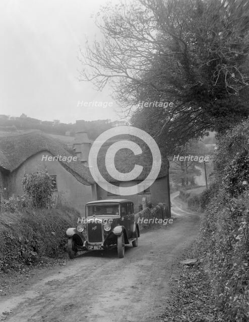 1931 Austin 16/6 on a road test, parked outside Parliament Cottage, Stoke Gabriel, Devon. Artist: Bill Brunell.