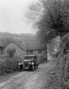 1931 Austin 16/6 on a road test, parked outside Parliament Cottage, Stoke Gabriel, Devon. Artist: Bill Brunell