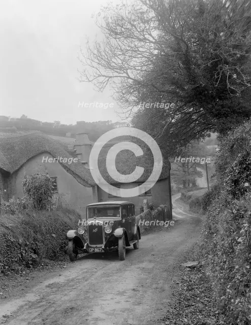 1931 Austin 16/6 on a road test, parked outside Parliament Cottage, Stoke Gabriel, Devon. Artist: Bill Brunell.
