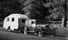 1931 Morris Isis saloon with Winchester caravan. Creator: Unknown